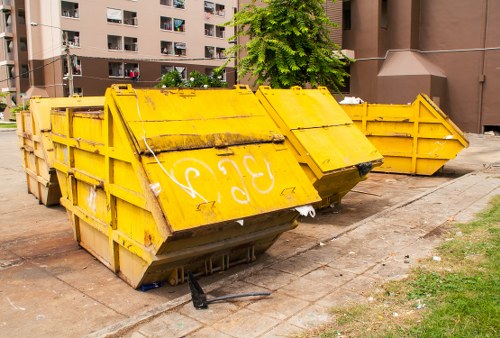 Commercial waste truck and crew preparing for collection